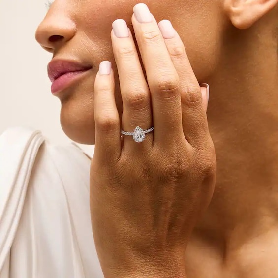 Previously Owned - 1 CT. T.w. Pear-Shaped Lab-Grown Diamond Frame Engagement Ring in 14K White Gold (F/Vs2)