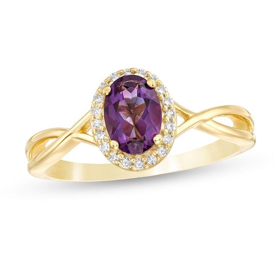 Previously Owned - Oval Amethyst and 1/15 CT. T.W. Diamond Frame Twist Shank Ring in 10K Gold