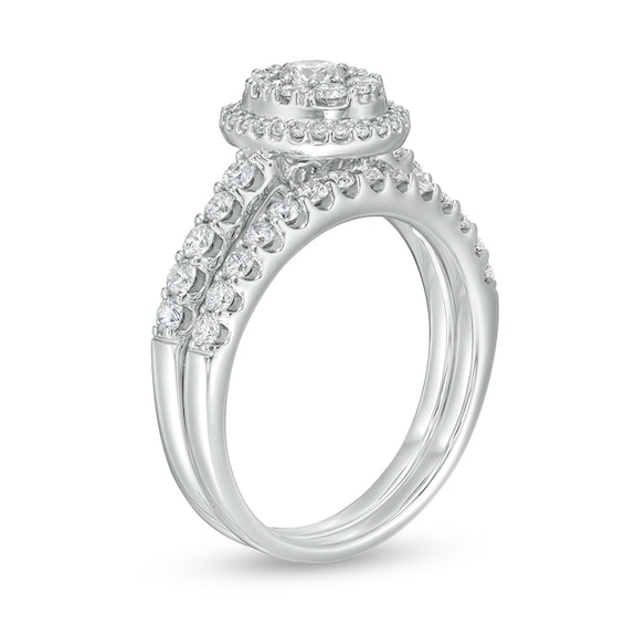 Previously Owned - 1 CT. T.w. Oval Multi-Diamond Frame Soldered Bridal Set in 14K White Gold