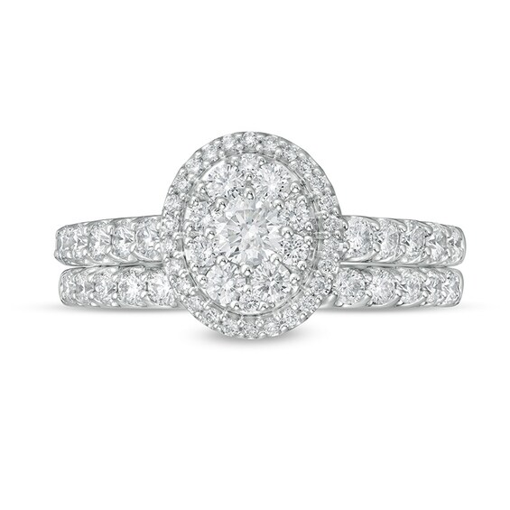 Previously Owned - 1 CT. T.w. Oval Multi-Diamond Frame Soldered Bridal Set in 14K White Gold