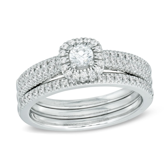 Previously Owned - 1/2 CT. T.w. Diamond Frame Three Piece Soldered Bridal Set in 14K White Gold