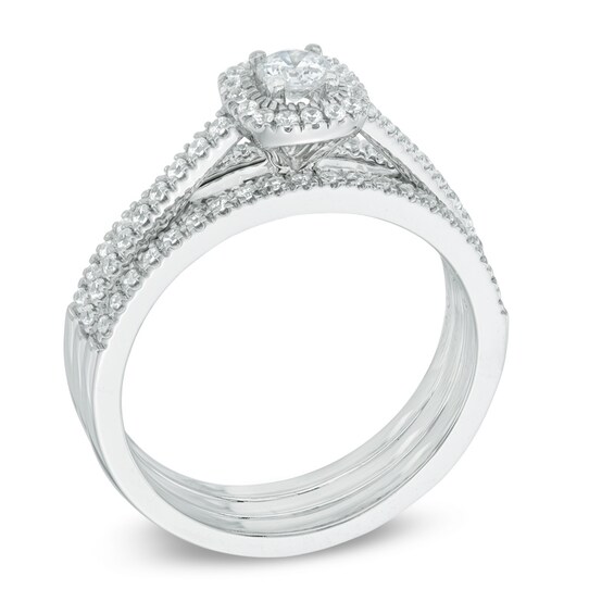 Previously Owned - 1/2 CT. T.w. Diamond Frame Three Piece Soldered Bridal Set in 14K White Gold