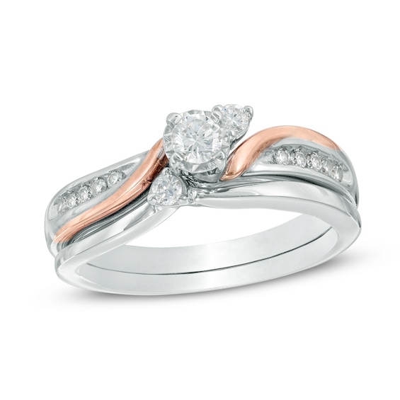 Previously Owned - 1/3 CT. T.w. Diamond Three Stone Slant Soldered Bridal Set in 10K Two-Tone Gold