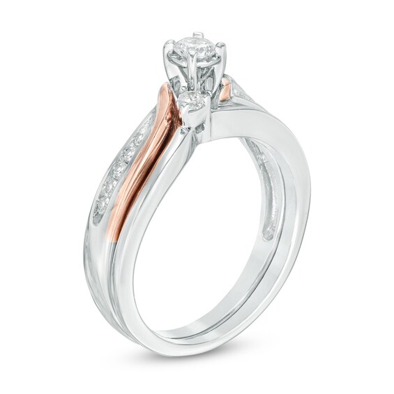 Previously Owned - 1/3 CT. T.w. Diamond Three Stone Slant Soldered Bridal Set in 10K Two-Tone Gold