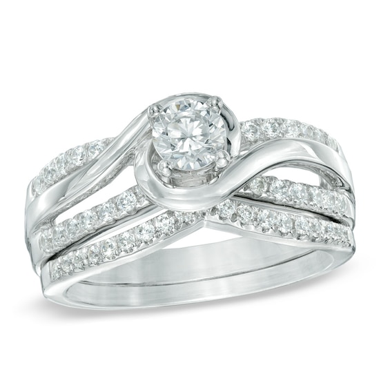 Previously Owned - 3/4 CT. T.w. Diamond Swirl Soldered Bridal Set in 14K White Gold