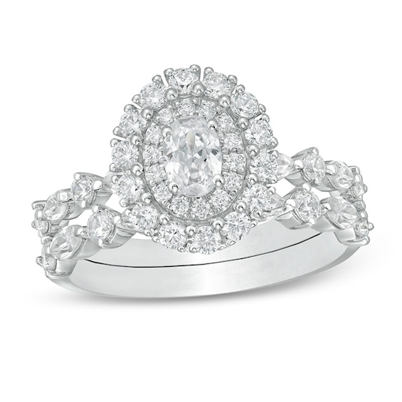 Previously Owned - 1-1/2 CT. T.w. Oval Diamond Double Frame Soldered Bridal Set in 14K White Gold (I/Si2)