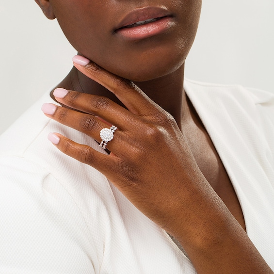 Previously Owned - 1-1/2 CT. T.w. Oval Diamond Double Frame Soldered Bridal Set in 14K White Gold (I/Si2)