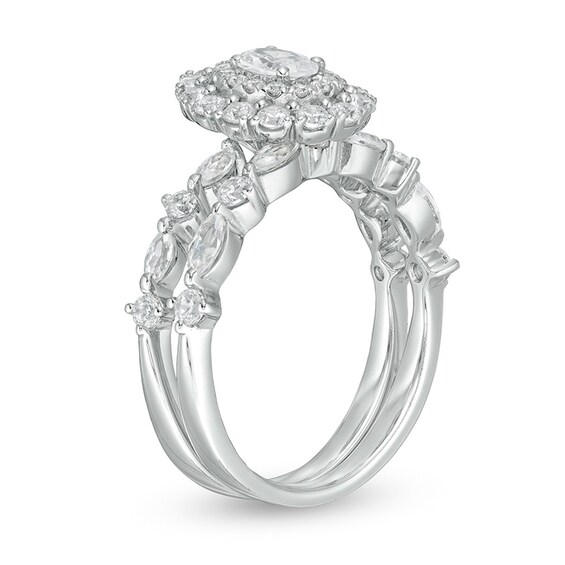 Previously Owned - 1-1/2 CT. T.w. Oval Diamond Double Frame Soldered Bridal Set in 14K White Gold (I/Si2)