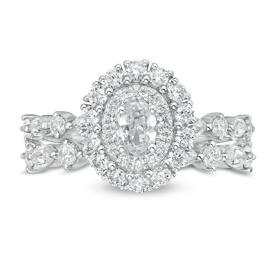 Previously Owned - 1-1/2 CT. T.w. Oval Diamond Double Frame Soldered Bridal Set in 14K White Gold (I/Si2)