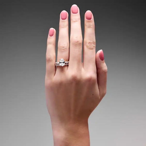 Previously Owned - Romantic Bouquet 4 CT. T.w. Oval Lab-Grown Diamond Bridal Set in 14K Gold (F/Vs2)