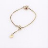 Thumbnail Image 3 of Child’s Disney Twinkle Tilted Minnie Mouse Ruby Bolo Bracelet in 14K Gold - 6.0"