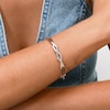 Thumbnail Image 4 of 1/5 CT. T.W. Baguette and Round Diamond Infinity Twist Bangle in Sterling Silver - 7.84"