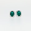 Thumbnail Image 4 of Oval Lab-Created Emerald and 1/6 CT. T.W. Diamond Open Octagon Frame Stud Earrings in 10K White Gold