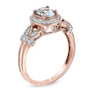 Thumbnail Image 1 of Oval Aquamarine and 1/6 CT. T.W. Diamond Frame Vine Ring in 10K Rose Gold