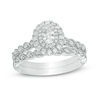 Thumbnail Image 0 of 3/4 CT. T.W. Oval Diamond Double Frame Twist Vintage-Style Bridal Set in 14K White Gold