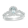 Thumbnail Image 0 of Oval Aquamarine and 1/5 CT. T.W. Diamond Frame Vintage-Style Bridal Set in 10K White Gold