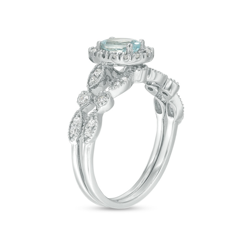 Oval Aquamarine and 1/5 CT. T.W. Diamond Frame Vintage-Style Bridal Set in 10K White Gold