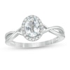 Thumbnail Image 0 of Oval Aquamarine and 1/15 CT. T.W. Diamond Frame Twist Shank Ring in 10K White Gold