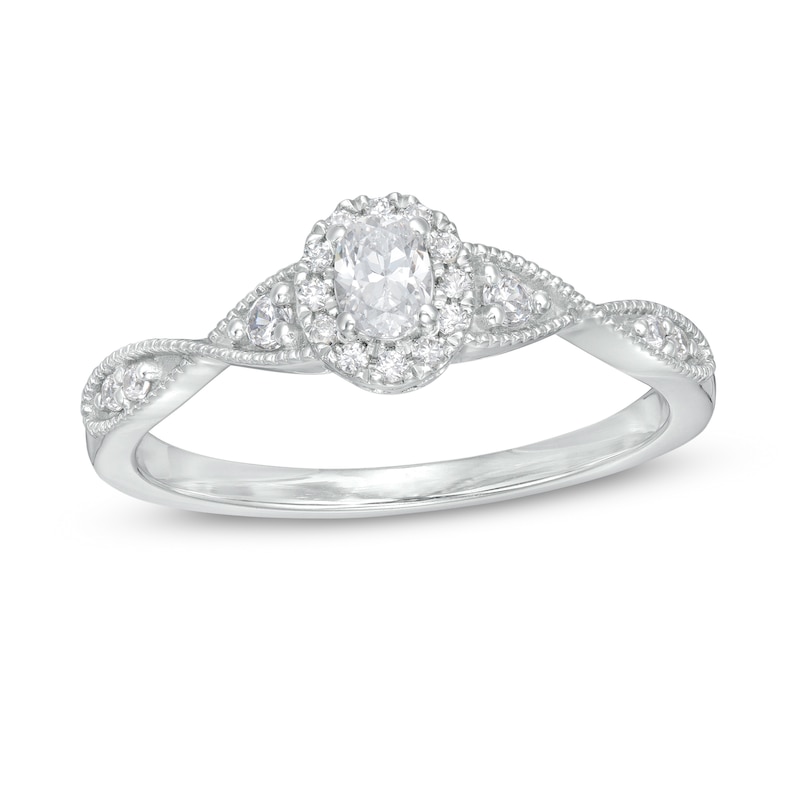 1/3 CT. T.W. Oval Diamond Frame Twist Shank Engagement Ring in 14K White Gold (I/SI2)