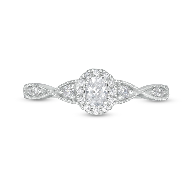 1/3 CT. T.W. Oval Diamond Frame Twist Shank Engagement Ring in 14K White Gold (I/SI2)